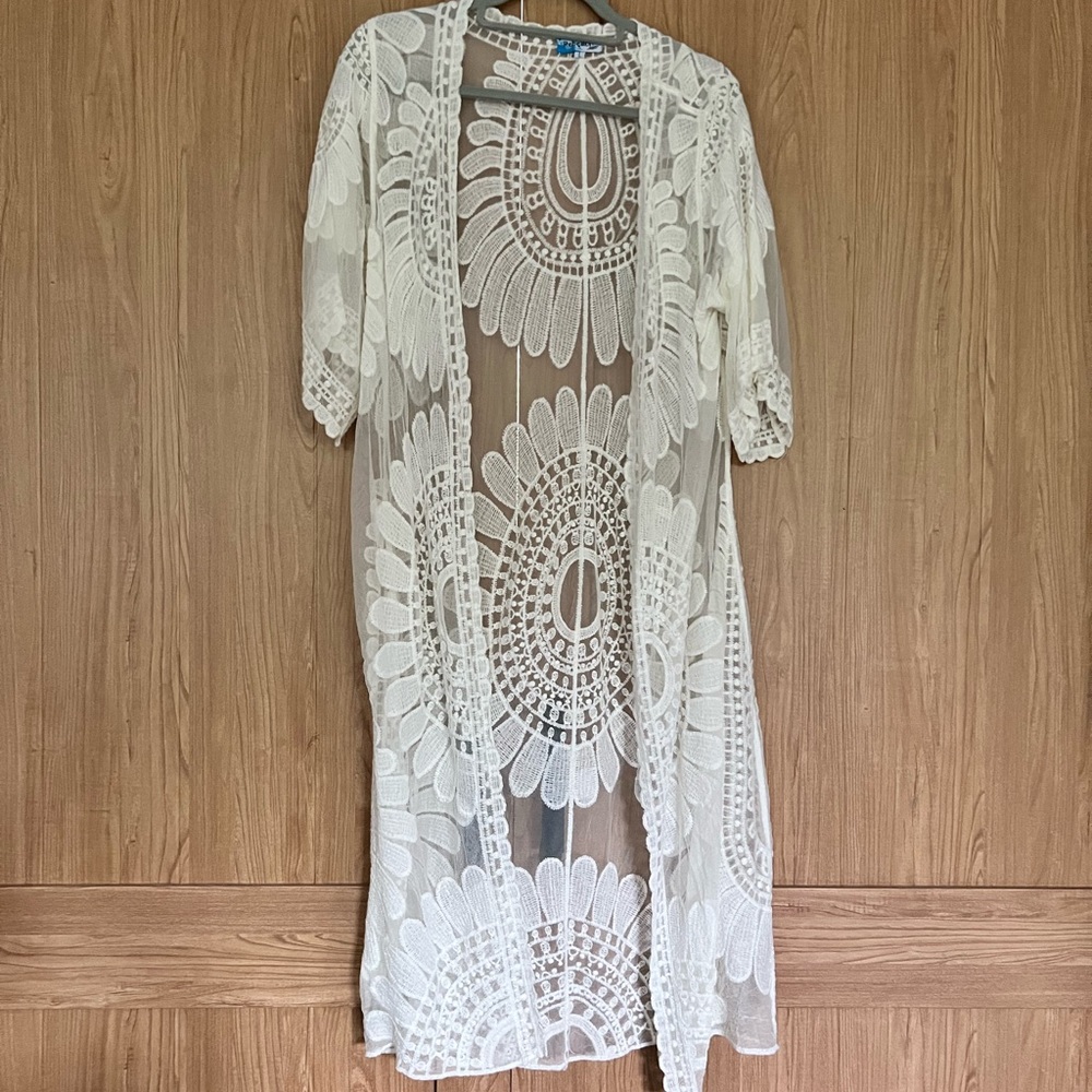 Beach cover or lacey layer over a tank.